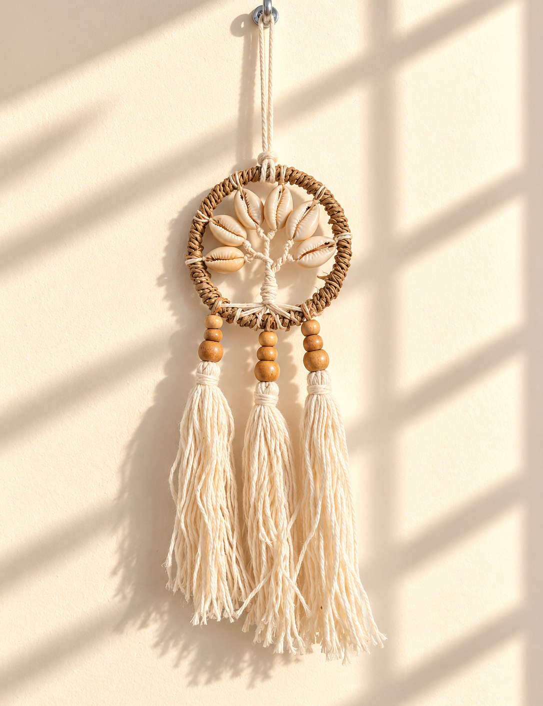 SunlitCowrieShellMacrameOrnament.png